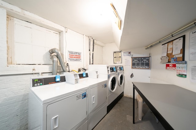 shared laundry area featuring washing machine and dryer