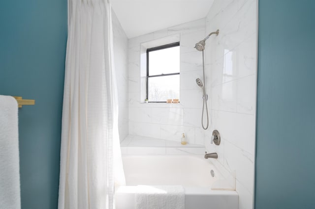 bathroom with shower / bath combination with curtain