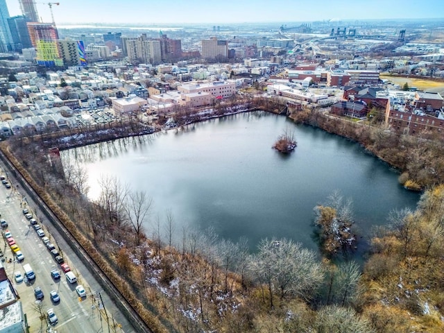 drone / aerial view featuring a water view and a city view