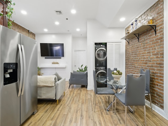 77 Crescent Ave Unit 8, Jersey City, NJ 07304 - dining space with stacked washer / dryer, wood finished floors, baseboards, and recessed lighting