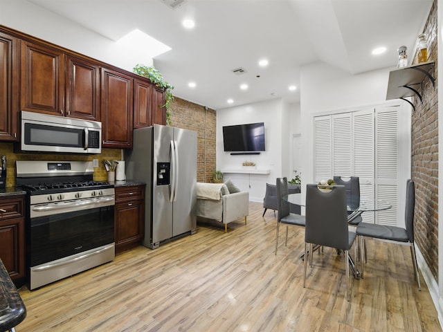 77 Crescent Ave Unit 8, Jersey City, NJ 07304 - kitchen with stainless steel appliances, brick wall, light wood-style flooring, and recessed lighting