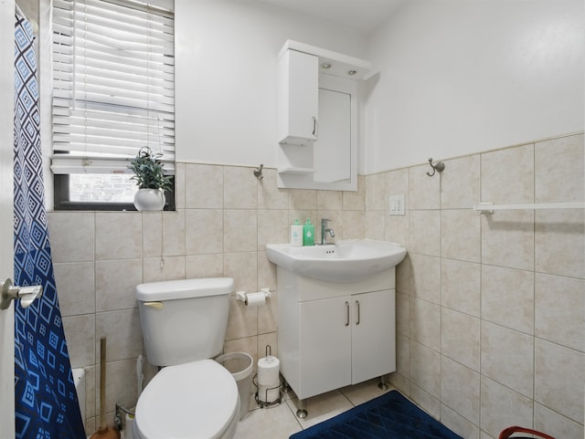 77 Crescent Ave Unit 8, Jersey City, NJ 07304 - bathroom featuring vanity, tile walls, tile patterned floors, toilet, and a shower with shower curtain
