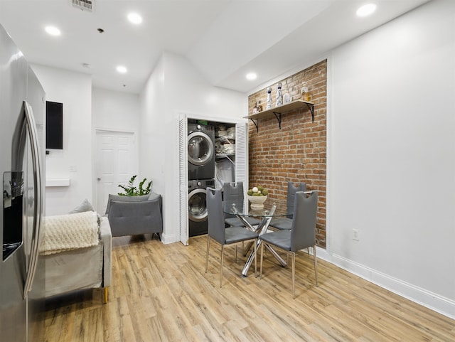 77 Crescent Ave Unit 8, Jersey City, NJ 07304 - sitting room with stacked washer and clothes dryer, light wood-type flooring, recessed lighting, and baseboards