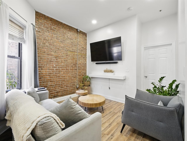 77 Crescent Ave Unit 8, Jersey City, NJ 07304 - living room featuring brick wall, wood finished floors, baseboards, and recessed lighting