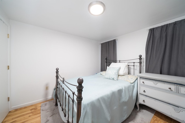 213 8th St, Jersey City, NJ 07302 - bedroom with light wood-type flooring and baseboards
