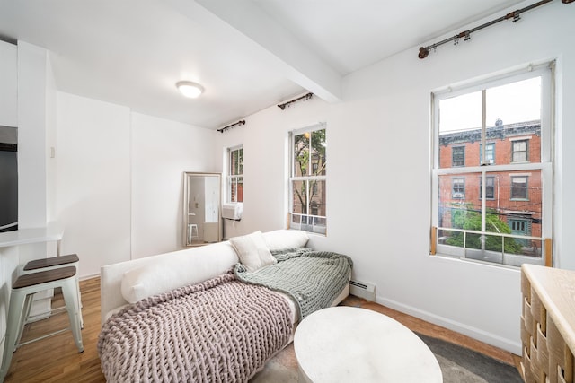 213 8th St, Jersey City, NJ 07302 - bedroom featuring baseboard heating and beam ceiling
