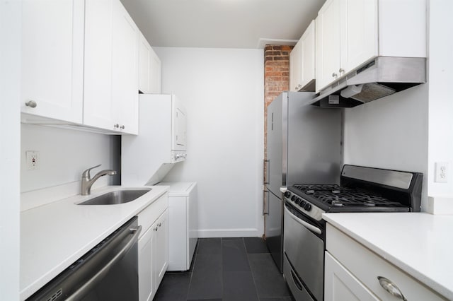 213 8th St, Jersey City, NJ 07302 - kitchen featuring stainless steel appliances, under cabinet range hood, white cabinets, and light countertops