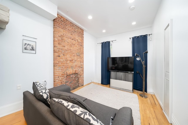 213 8th St, Jersey City, NJ 07302 - living room with light wood finished floors, recessed lighting, and a fireplace