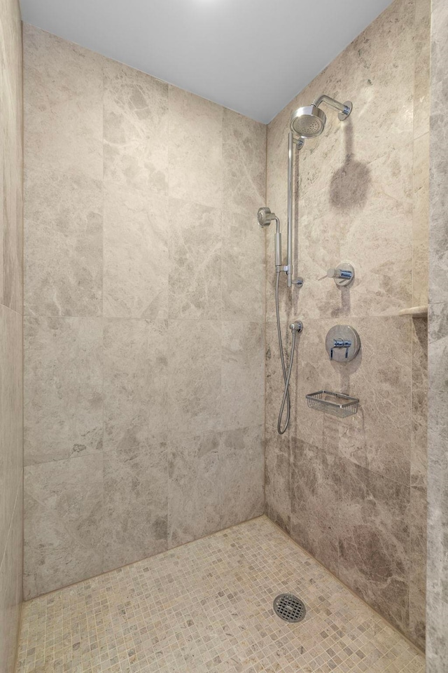 bathroom with a tile shower