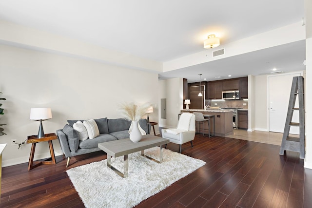 living room featuring dark hardwood / wood-style floors