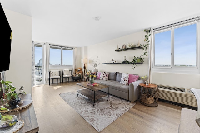 100 Manhattan Ave Unit 1217, Union City, NJ 07087 - living area featuring wood finished floors and an AC wall unit