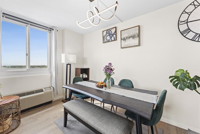 100 Manhattan Ave Unit 1217, Union City, NJ 07087 - dining space featuring baseboards, light wood-type flooring, and a chandelier