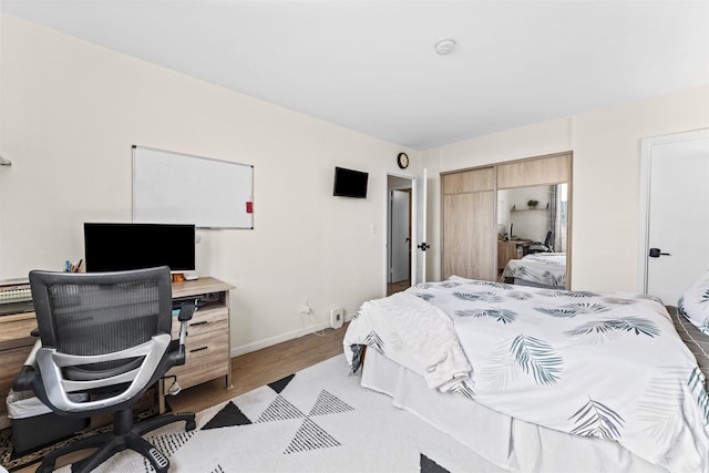 100 Manhattan Ave Unit 1217, Union City, NJ 07087 - bedroom featuring a desk, baseboards, a closet, and wood finished floors