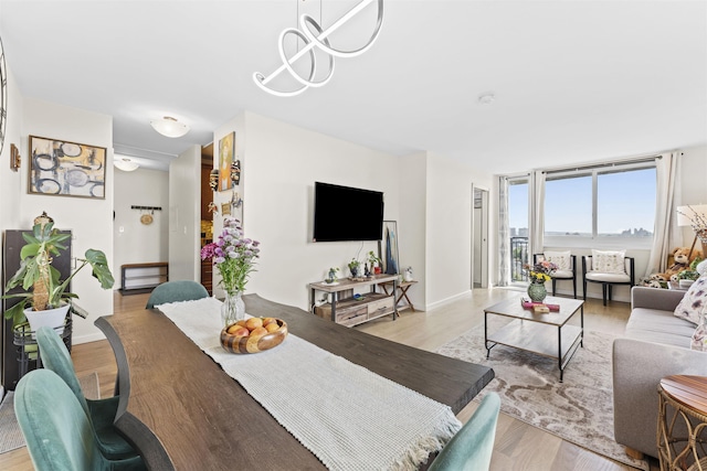 100 Manhattan Ave Unit 1217, Union City, NJ 07087 - dining area featuring light wood-style flooring and baseboards