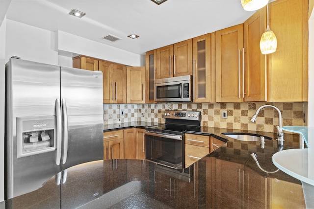 6601 Granton Ave Unit B1, North Bergen, NJ 07047 - kitchen with stainless steel appliances, a sink, glass insert cabinets, and dark stone counters