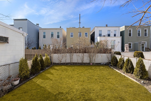 view of yard with a fenced backyard