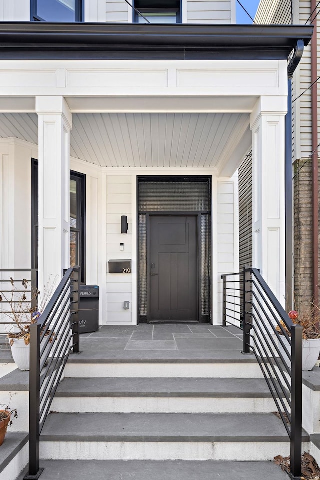 entrance to property featuring a porch