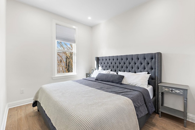 bedroom featuring recessed lighting, wood finished floors, and baseboards