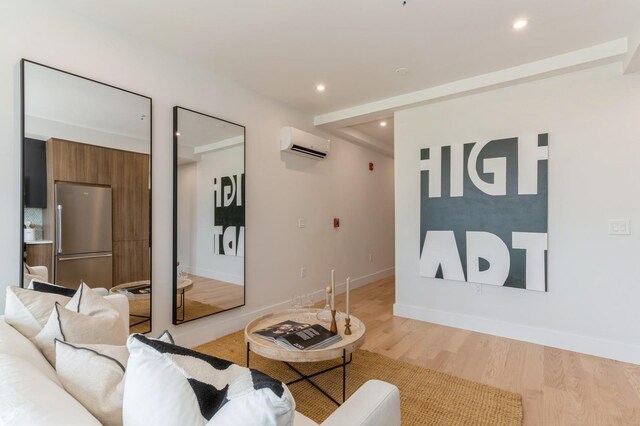 433 Central Ave Unit 3A, Jersey City, NJ 07307 - living area featuring an AC wall unit, light wood finished floors, and recessed lighting