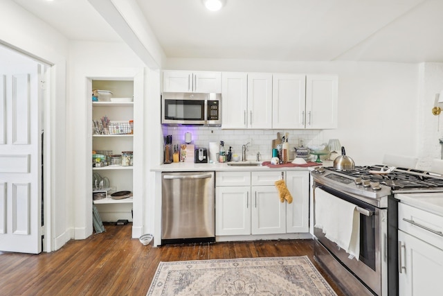 300 Barrow St, Jersey City, NJ 07302 - kitchen featuring light countertops, appliances with stainless steel finishes, dark wood-style flooring, and a sink