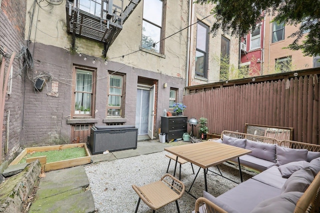 300 Barrow St, Jersey City, NJ 07302 - view of patio featuring central air condition unit, an outdoor hangout area, and fence