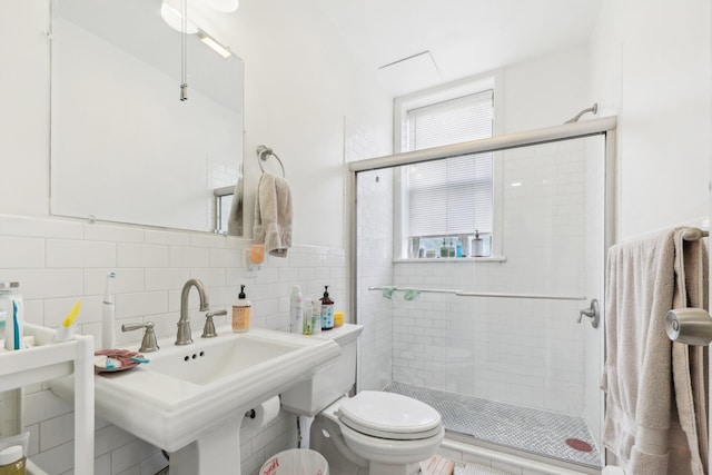 300 Barrow St, Jersey City, NJ 07302 - full bath featuring tile walls, toilet, a wealth of natural light, and a stall shower