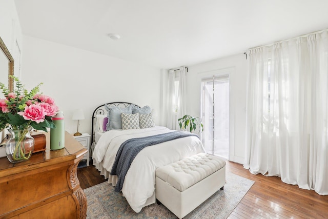 300 Barrow St, Jersey City, NJ 07302 - bedroom featuring light wood-type flooring and access to exterior