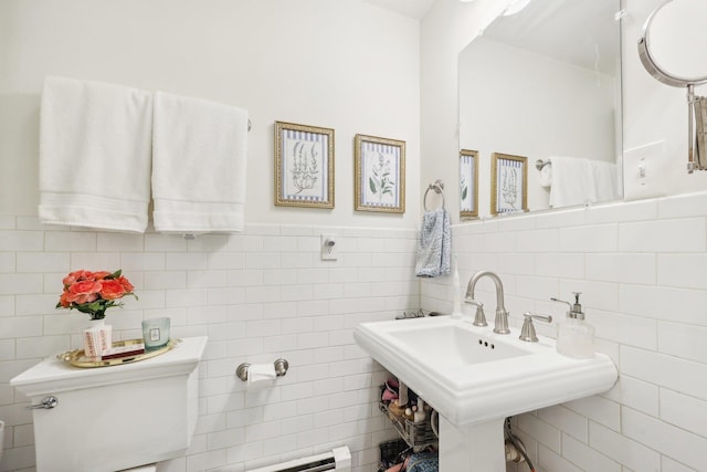 300 Barrow St, Jersey City, NJ 07302 - bathroom featuring tile walls, toilet, and a wainscoted wall