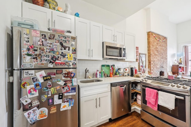 300 Barrow St, Jersey City, NJ 07302 - kitchen featuring a sink, white cabinetry, light countertops, tasteful backsplash, and appliances with stainless steel finishes