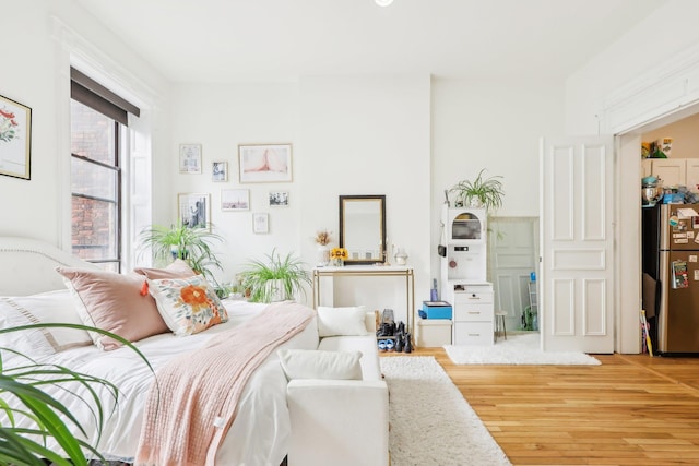 300 Barrow St, Jersey City, NJ 07302 - bedroom featuring freestanding refrigerator and wood finished floors