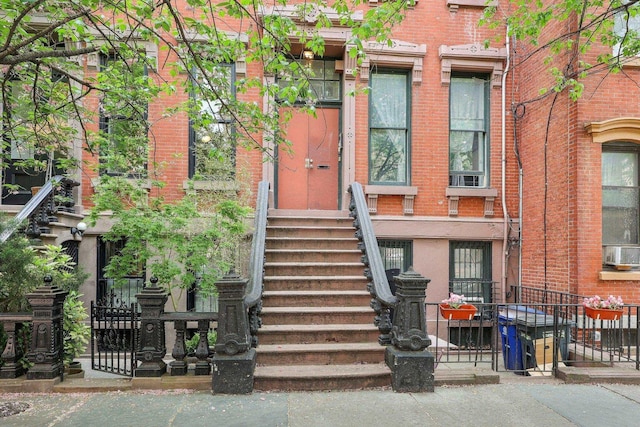 300 Barrow St, Jersey City, NJ 07302 - entrance to property with fence, cooling unit, and brick siding