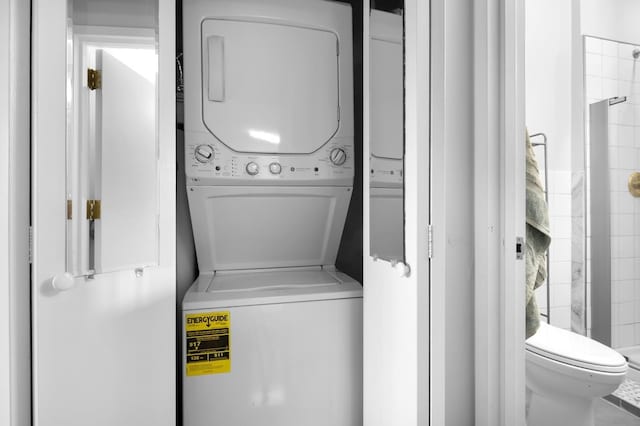 laundry room featuring laundry area and stacked washer and dryer