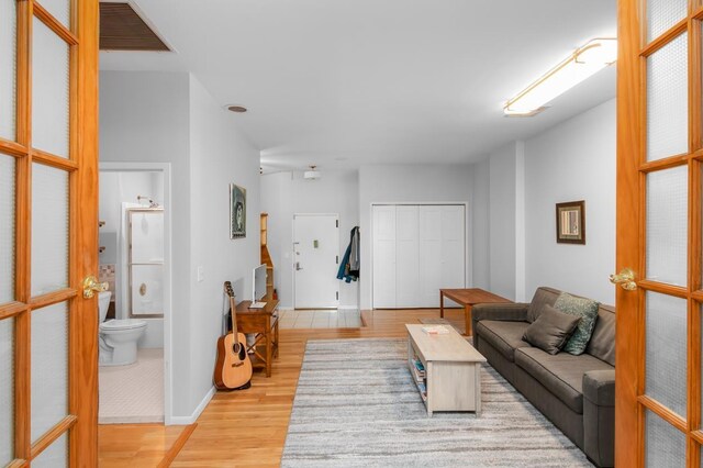 living room with wood finished floors and visible vents