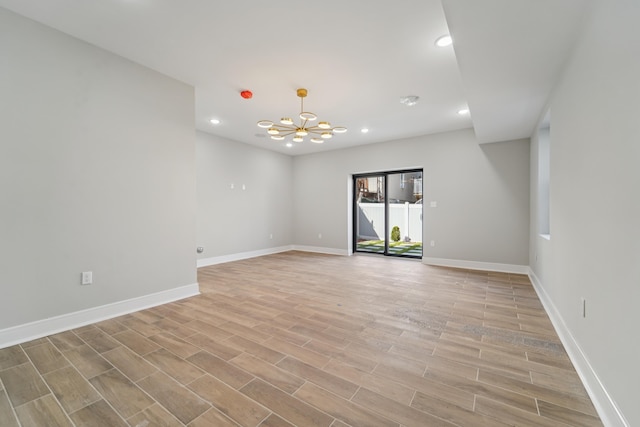 313 Lembeck Ave Unit 1, Jersey City, NJ 07305 - spare room with a chandelier, recessed lighting, and light wood-style flooring