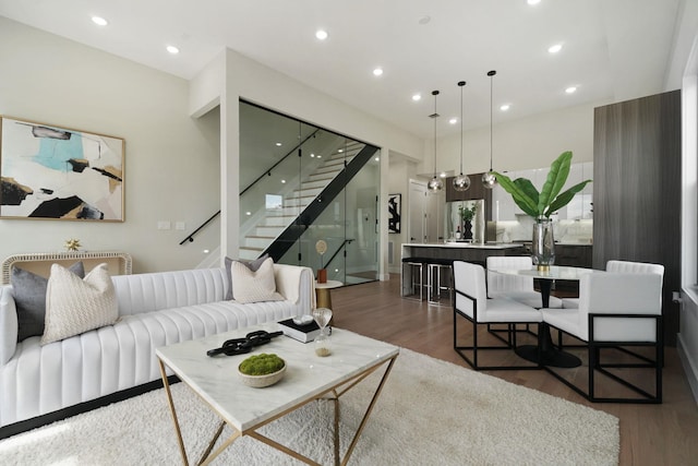 living room with dark hardwood / wood-style flooring