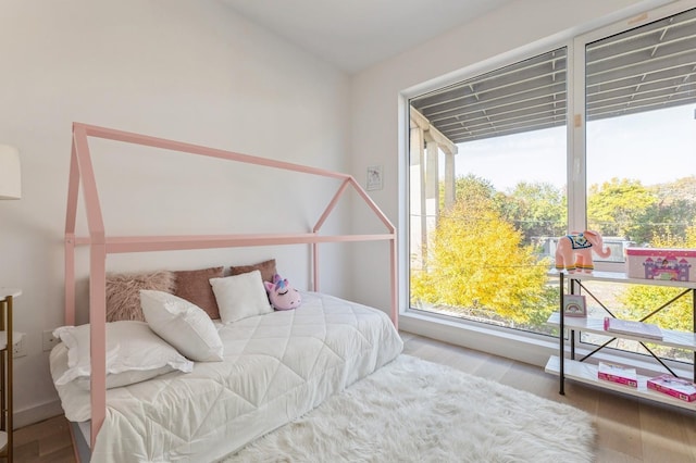 bedroom with wood finished floors