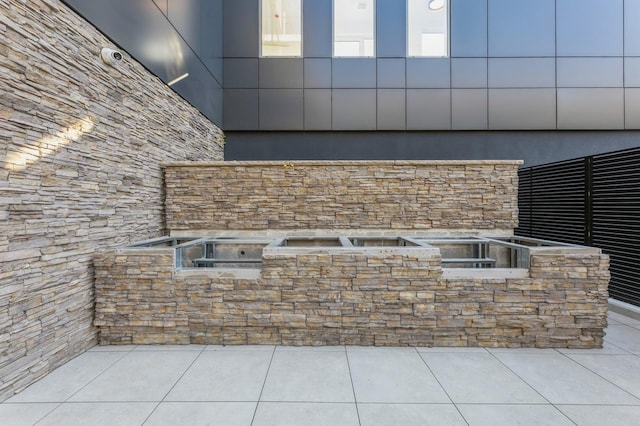 exterior space with stone siding