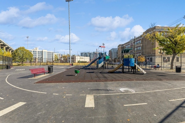 community jungle gym featuring fence