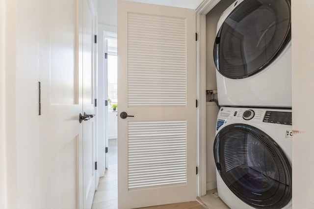 laundry area featuring laundry area and stacked washer / dryer