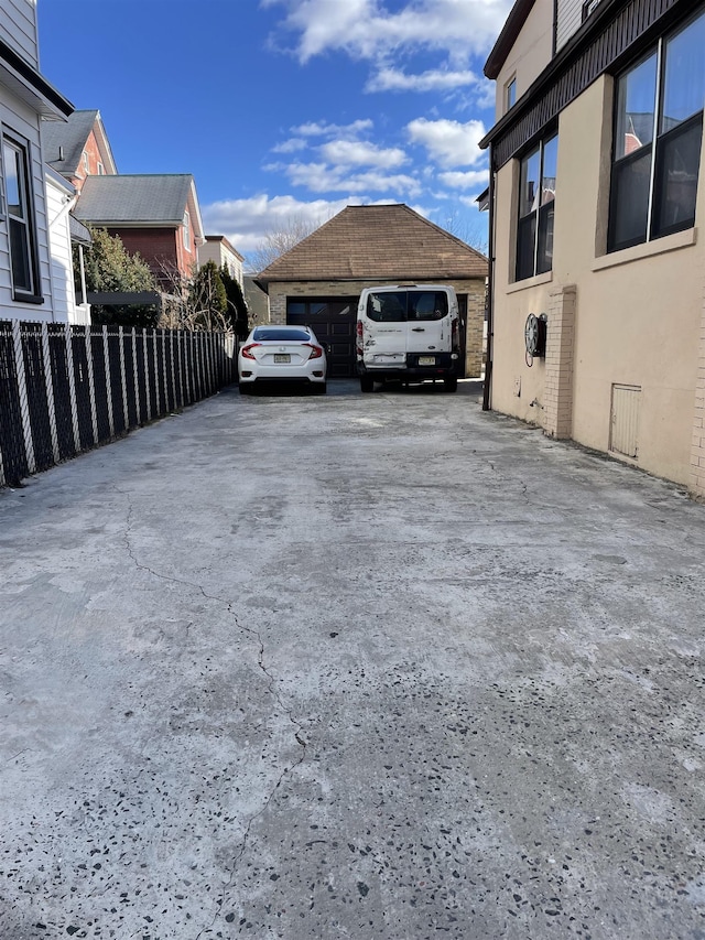 exterior space with an outbuilding and a garage