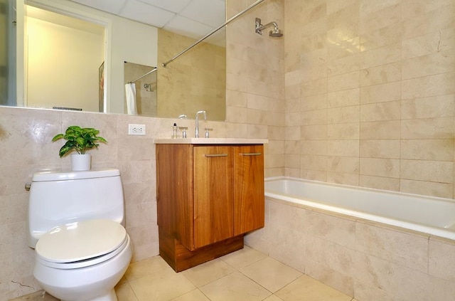 4 Beacon Way Unit 1110, Jersey City, NJ 07304 - full bathroom with tile walls, tile patterned flooring, toilet, tiled shower / bath combo, and vanity