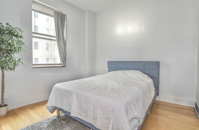 4 Beacon Way Unit 1110, Jersey City, NJ 07304 - bedroom featuring wood finished floors and baseboards