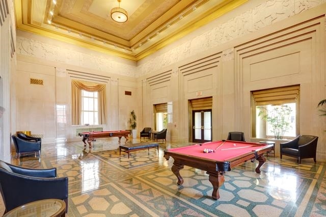 4 Beacon Way Unit 1110, Jersey City, NJ 07304 - recreation room featuring a towering ceiling, pool table, a decorative wall, and ornamental molding