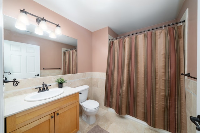 721 Madison St Unit 4N, Hoboken, NJ 07030 - bathroom featuring vanity, tile walls, tile patterned floors, and wainscoting
