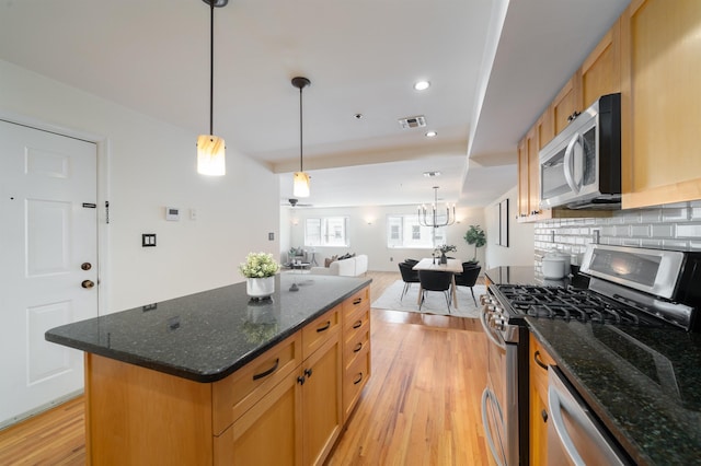 721 Madison St Unit 4N, Hoboken, NJ 07030 - kitchen with stainless steel appliances, light wood-style floors, tasteful backsplash, a center island, and open floor plan
