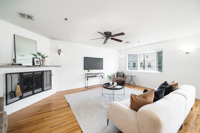 721 Madison St Unit 4N, Hoboken, NJ 07030 - living area featuring ceiling fan, a fireplace, and light wood-style floors