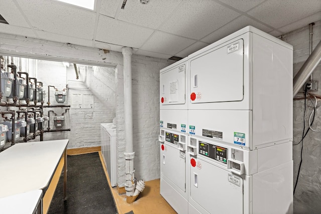 clothes washing area featuring separate washer and dryer and stacked washer and dryer