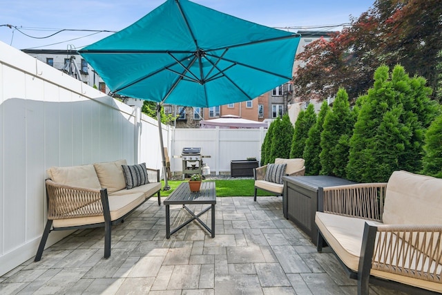 243 3rd St Unit 1, Jersey City, NJ 07302 - fenced backyard with outdoor lounge area, grilling area, and a patio