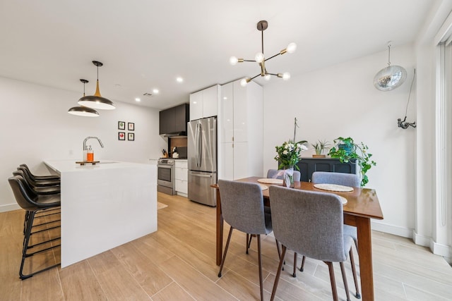 243 3rd St Unit 1, Jersey City, NJ 07302 - dining space featuring recessed lighting, light wood-style floors, and a chandelier