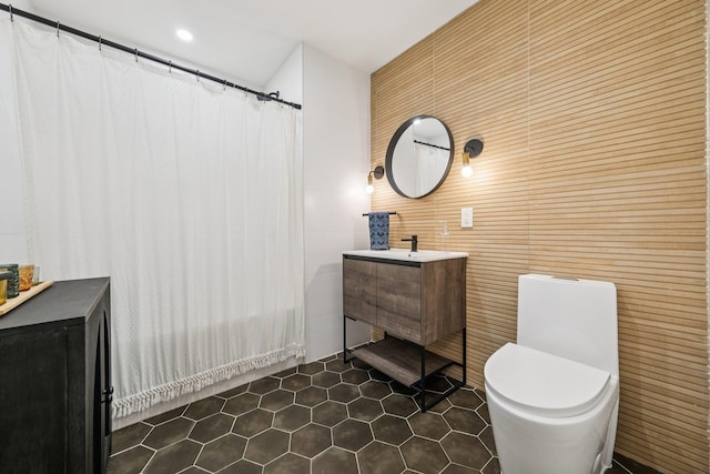 243 3rd St Unit 1, Jersey City, NJ 07302 - bathroom featuring vanity, tile patterned flooring, wooden walls, and a shower with shower curtain